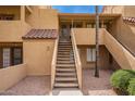 Exterior of a unit with access stairs and desert landscaping at 4901 S Calle Los Cerros Dr # 219, Tempe, AZ 85282