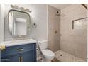 Updated bathroom features tiled shower, modern vanity, and sleek fixtures at 508 W Pampa Ave, Mesa, AZ 85210