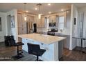 Bright kitchen features quartz countertops, modern stainless appliances, and a large center island at 5100 E Rancho Paloma Dr # 1044, Cave Creek, AZ 85331