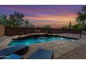 Beautiful pool with brick surround and relaxing lounge chairs, perfect for enjoying the sunset at 639 N 110Th Pl, Mesa, AZ 85207