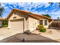 Inviting single-level home with a two-car garage and low-maintenance front yard at 7822 W Mcrae Way, Glendale, AZ 85308