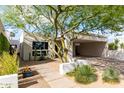 Attractive home featuring modern architecture, desert landscaping, and covered parking at 8754 E Via De Sereno --, Scottsdale, AZ 85258