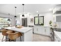 Bright, modern kitchen with white cabinetry, stainless steel appliances, and a large island at 8754 E Via De Sereno --, Scottsdale, AZ 85258