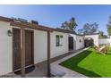 Charming single-story home with private entry featuring a secure front door, landscaped courtyard at 1029 E Marco Polo Rd, Phoenix, AZ 85024