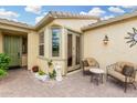 Inviting outdoor patio featuring a seating area and stylish brick pavers, ideal for outdoor enjoyment at 13051 W Black Hill Rd, Peoria, AZ 85383