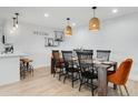 Beautiful dining room featuring a wood table, stylish seating, and decorative pendant lights at 1307 E Encanto St, Mesa, AZ 85203