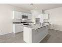 The kitchen features granite countertops, stainless steel appliances, and a functional center island at 1343 W Hess Ave, Coolidge, AZ 85128