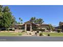 Inviting single-level home with desert landscaping and a cozy front yard at 1348 E Los Arboles Dr, Tempe, AZ 85284