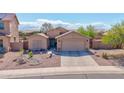 Attractive single-Gathering home with well-kept desert landscaping and a two-car garage at 1385 E Martha Dr, Casa Grande, AZ 85122
