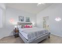 Bright main bedroom with hardwood floors and light walls, with ensuite bathroom at 17128 E Kensington Pl, Fountain Hills, AZ 85268