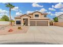 Two-story home with a three-car garage and desert landscaping at 2143 N Chestnut Cir, Mesa, AZ 85213