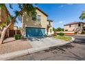 View of the home featuring a spacious driveway and well-maintained landscaping at 2167 S Luther Ave, Mesa, AZ 85209
