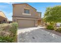 Charming two-story home featuring a two-car garage and neat landscaping at 25457 W Clanton Ave, Buckeye, AZ 85326