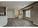 Bright living area features wood-look floors and a chandelier at 2600 E La Costa Dr, Chandler, AZ 85249