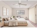 Serene main bedroom features a ceiling fan, neutral decor, and a comfortable layout with a window at 3031 N Civic Center Plz # 112, Scottsdale, AZ 85251