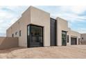 Contemporary home showing modern design with clean lines and desert-friendly landscaping at 33857 N Borgata Trl, San Tan Valley, AZ 85144
