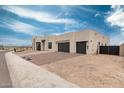 Modern home with two car garage, desert landscaping and clean architectural lines at 33857 N Borgata Trl, San Tan Valley, AZ 85144