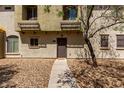 Charming townhouse entrance with a walkway and decorative rock landscaping for a welcoming feel at 343 N 169Th Ave, Goodyear, AZ 85338