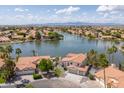 Picturesque waterfront community featuring gorgeous homes, a serene lake, and stunning mountain views at 3520 N 110Th Ave, Avondale, AZ 85392
