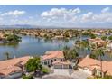 Beautiful aerial view of a lakeside community with homes nestled along the serene water at 3520 N 110Th Ave, Avondale, AZ 85392