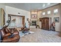 Spacious living room with tile floors, a fireplace, high ceilings, and an abundance of natural light at 38065 N Cave Creek Rd # 9, Cave Creek, AZ 85331