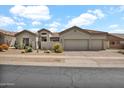 Charming single-story home with desert landscaping, clay tile roof, and a spacious three-car garage at 4607 E Sierra Sunset Trl, Cave Creek, AZ 85331