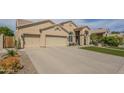 Beautiful single-story home showcasing a spacious driveway and low-maintenance landscaping at 5900 W Orchid Ln, Chandler, AZ 85226