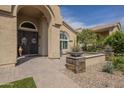 Attractive home entryway with stone accents, desert plants, and a charming 'Welcome' sign at 5900 W Orchid Ln, Chandler, AZ 85226