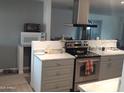 View of a kitchen with stainless steel appliances at 610 E Estevan Ave, Apache Junction, AZ 85119