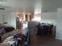 A spacious living room featuring hard flooring and an open concept design at 610 E Estevan Ave, Apache Junction, AZ 85119