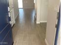 Inviting entryway featuring stylish, light-toned tile flooring that seamlessly connects to the rest of the home at 7244 E Hackamore Ln, San Tan Valley, AZ 85143