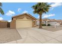 A comfortable one-story home featuring a two-car garage and desert landscaping at 881 W Saragosa St, Chandler, AZ 85225