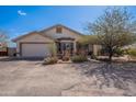 Well-maintained single-story home featuring a two-car garage and desert landscaping at 907 N Mountain Rd, Mesa, AZ 85207