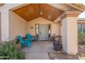 Charming front porch with decorative plants, seating, and a welcoming entrance at 907 N Mountain Rd, Mesa, AZ 85207