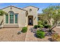 Home featuring desert landscaping, decorative front door, and a brick walkway at 10350 E Texas Ave, Mesa, AZ 85212