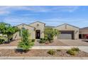 Inviting home with desert landscaping, a brick walkway, and a two-car garage at 10350 E Texas Ave, Mesa, AZ 85212