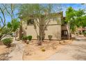 The home's exterior has desert landscaping with walking paths, plants, and trees at 19700 N 76Th St # 2101, Scottsdale, AZ 85255
