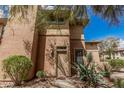 Exterior shot showcasing the front entrance with desert landscaping and a charming facade at 19777 N 76Th St # 1131, Scottsdale, AZ 85255