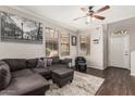 Comfortable living room featuring a gray sectional, stylish decor, and plenty of natural light at 19777 N 76Th St # 1131, Scottsdale, AZ 85255