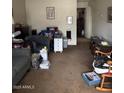 Cozy living room with comfortable seating and carpet flooring at 2141 W Elm St, Phoenix, AZ 85015