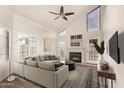 Bright living room featuring vaulted ceilings, fireplace, and modern decor at 2309 W Shawnee Dr, Chandler, AZ 85224