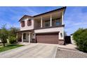 Charming two-story home with a spacious two-car garage, balcony, and manicured front yard at 2348 W Alta Vista Rd, Phoenix, AZ 85041