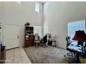 Bright living room with high ceilings and ample natural light from multiple large windows at 2348 W Alta Vista Rd, Phoenix, AZ 85041