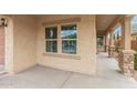 Covered porch with stone columns and plenty of space to decorate at 2425 E Flintlock Dr, Gilbert, AZ 85298