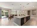 Open-concept kitchen and dining space with stainless steel appliances and a bright, airy feel at 2792 N Acacia Way, Buckeye, AZ 85396