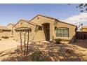 Inviting single-story home with a well-maintained desert landscape and an attached two-car garage at 3122 W Dunbar Dr, Phoenix, AZ 85041