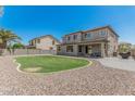 Expansive backyard with a well-maintained lawn and patio, great for outdoor living at 3528 E Tonto Dr, Gilbert, AZ 85298