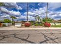 Charming single-story home featuring mature landscaping, flowering bushes, and a well-maintained lawn at 3954 E Becker Ln, Phoenix, AZ 85028