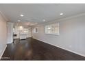 Open-concept living space with hardwood floors and modern lighting fixtures at 4201 N 35Th St, Phoenix, AZ 85018