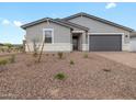Single-story home showcasing neutral paint, low-maintenance landscaping, and a convenient two-car garage at 4777 W Hunter Trl, San Tan Valley, AZ 85144